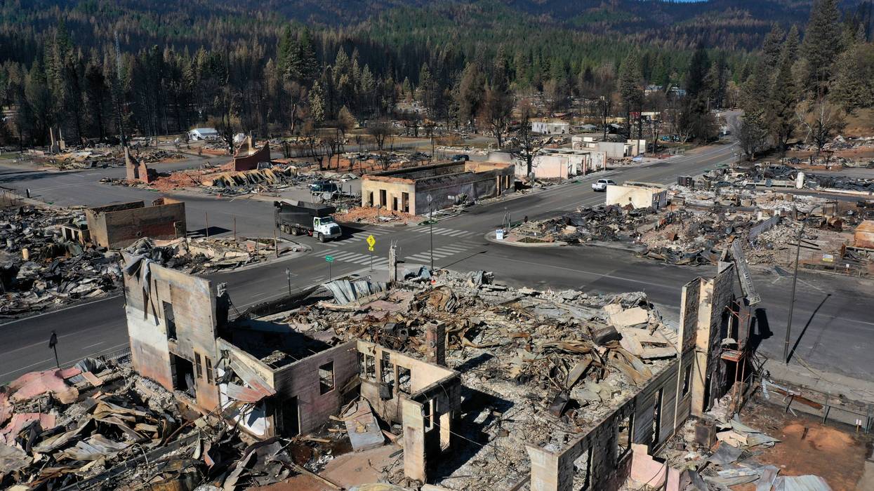 In an aerial view, the remains of homes and businesses that were destroyed by the Dixie Fire are visible on September 24, 2021 in Greenville, California.