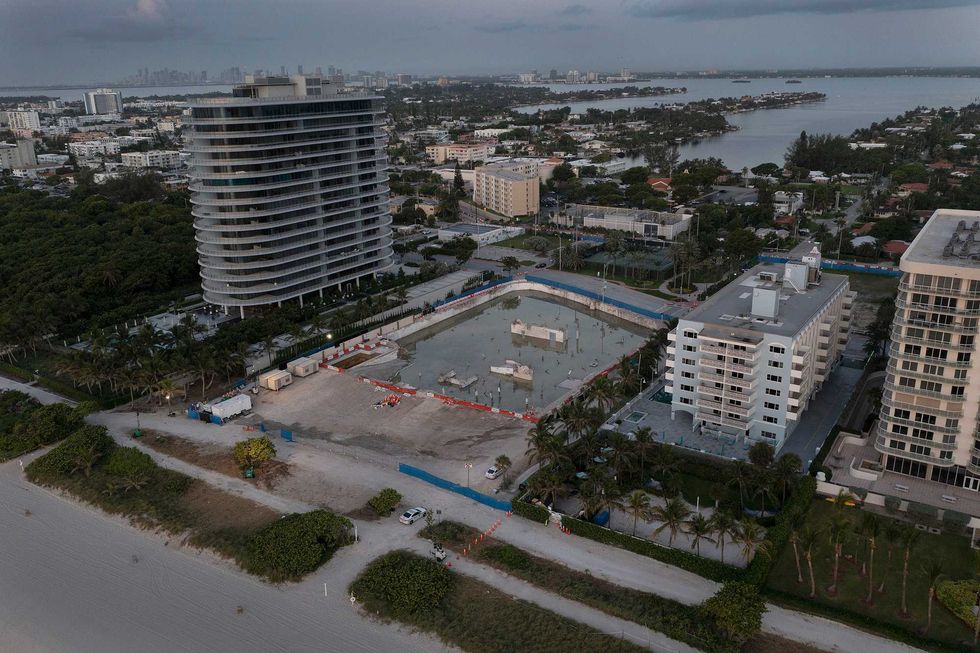 In this aerial view, the cleared lot that was where the collapsed 12-story Champlain Towers South condo building once stood on July 31, 2021 in Surfside, Florida. A total of 98 people died when the building partially collapsed on June 24, 2021.