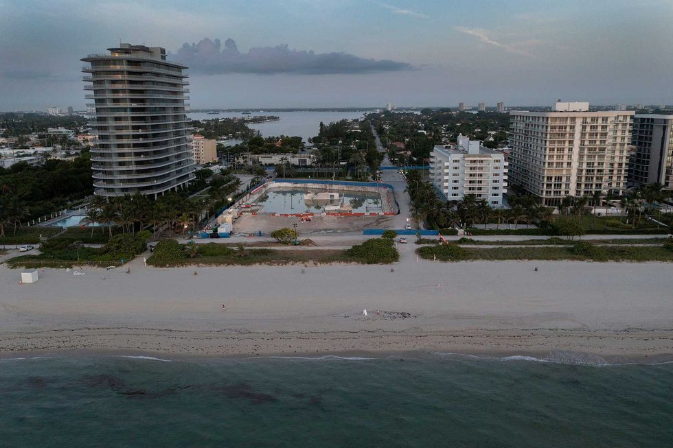 In this aerial view, the cleared lot that was where the collapsed 12-story Champlain Towers South condo building once stood, on July 31, 2021 in Surfside, Florida. A total of 98 people died when the building partially collapsed on June 24, 2021.