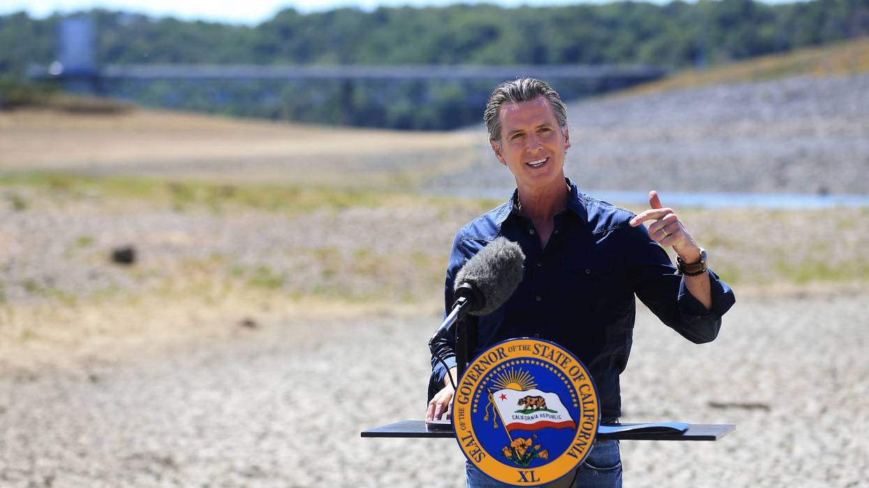 In this April 21, 2021, file photo California Gov. Gavin Newsom speaks at a news conference in the parched basin of Lake Mendocino in Ukiah, Calif., where he announced he would proclaim a drought emergency for Mendocino and Sonoma counties. On Thursday July 8, 2021, Newsom asked people to voluntarily reduce their water use by 15% in the middle of the drought. He also added nine more counties to the state's emergency proclamation. (Kent Porter/The Press Democrat via AP, File)