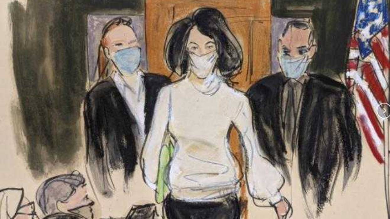 In this courtroom sketch, Ghislaine Maxwell enters the courtroom escorted by U.S. Marshalls at the start of her trial, Nov. 29, 2021, in New York. A judge has declined to throw out Maxwell’s sex trafficking conviction, despite a juror’s failure to disclose he’d been a victim of childhood sexual abuse. U.S. District Judge Alison J. Nathan on Friday, April 1, 2022, refused to order a new trial for Maxwell, who was convicted in December of helping the American millionaire Jeffrey Epstein abuse several teenage girls.