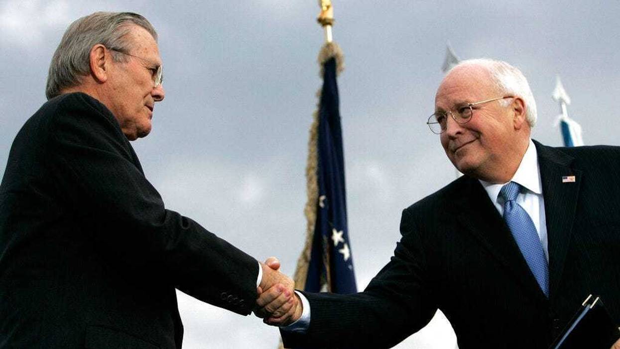 In this Dec. 15, 2006, file photo, outgoing Defense Secretary Donald H. Rumsfeld, left, shakes hands with Vice President Dick Cheney during an Armed Forces Full Honor Review for Rumsfeld at the Pentagon. (AP Photo/Pablo Martinez Monsivais, File)