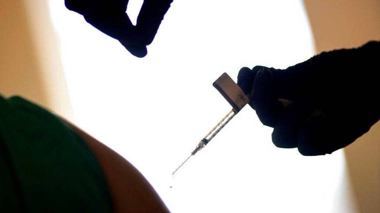 In this Dec. 15, 2020, file photo, a droplet falls from a syringe after a health care worker was injected with the Pfizer-BioNTech COVID-19 vaccine at Women & Infants Hospital in Providence, R.I. (AP Photo/David Goldman, File)