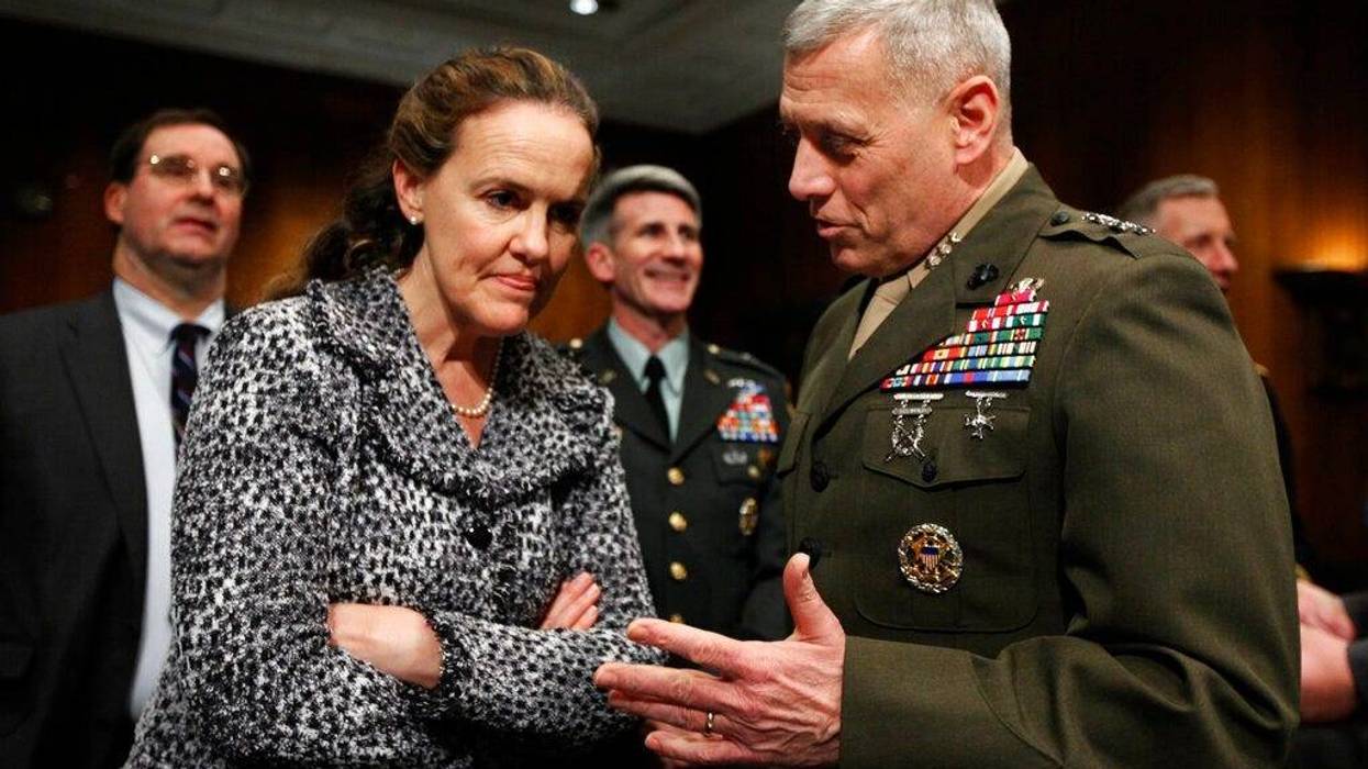 In this Feb. 22, 2010, file photo then-Defense Undersecretary for Policy Michele Flournoy, left, talks with Marines Lt. Gen. John Paxton