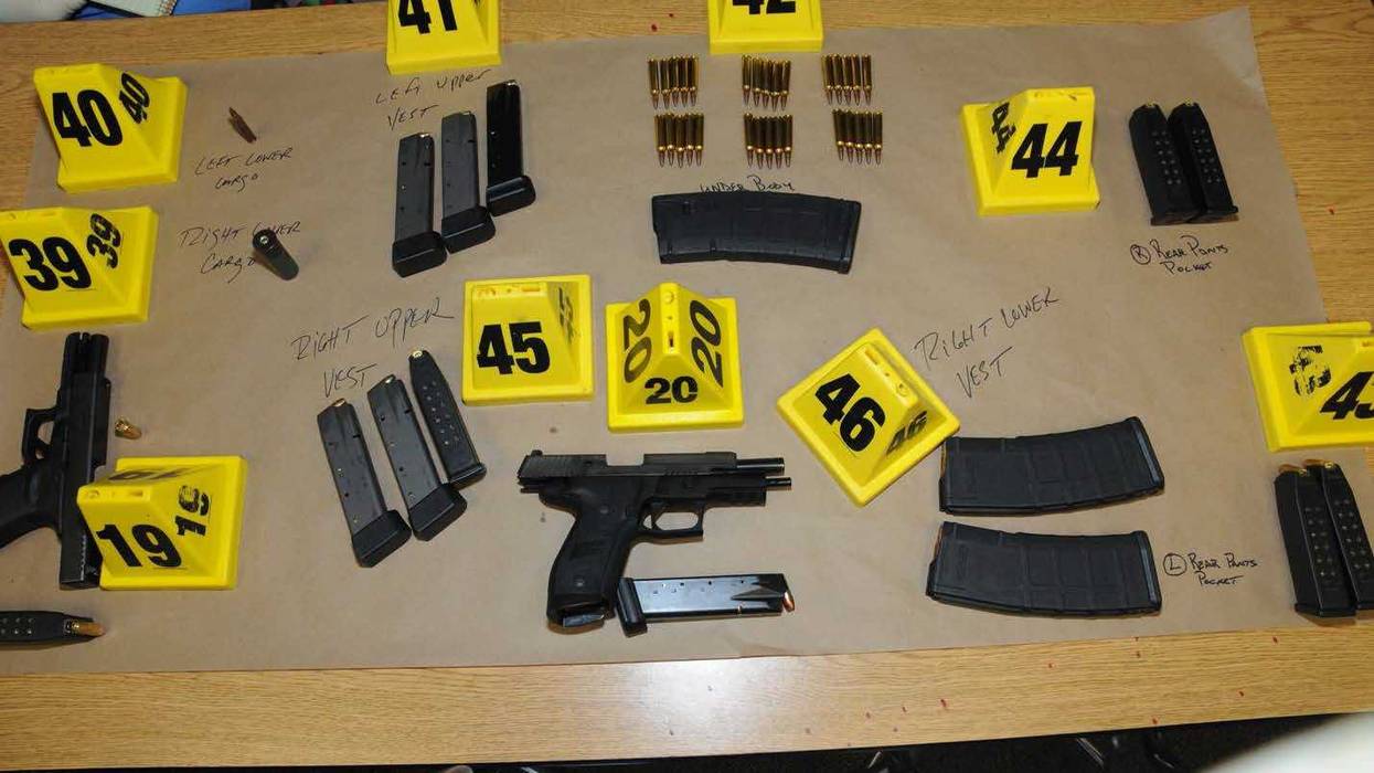 In this handout crime scene evidence photo provided by the Connecticut State Police, shows firearms and ammunition found on or in close proximity to shooters body at Sandy Hook Elementary School following the December 14, 2012 shooting rampage, taken on an unspecified date in Newtown, Connecticut. A second report was released December 27, 2013 by Connecticut State Attorney Stephen Sedensky III gave more details of the the Newtown school shooting by Adam Lanza that left 20 children and six women educators dead inside Sandy Hook Elementary School after killing his mother at their home.