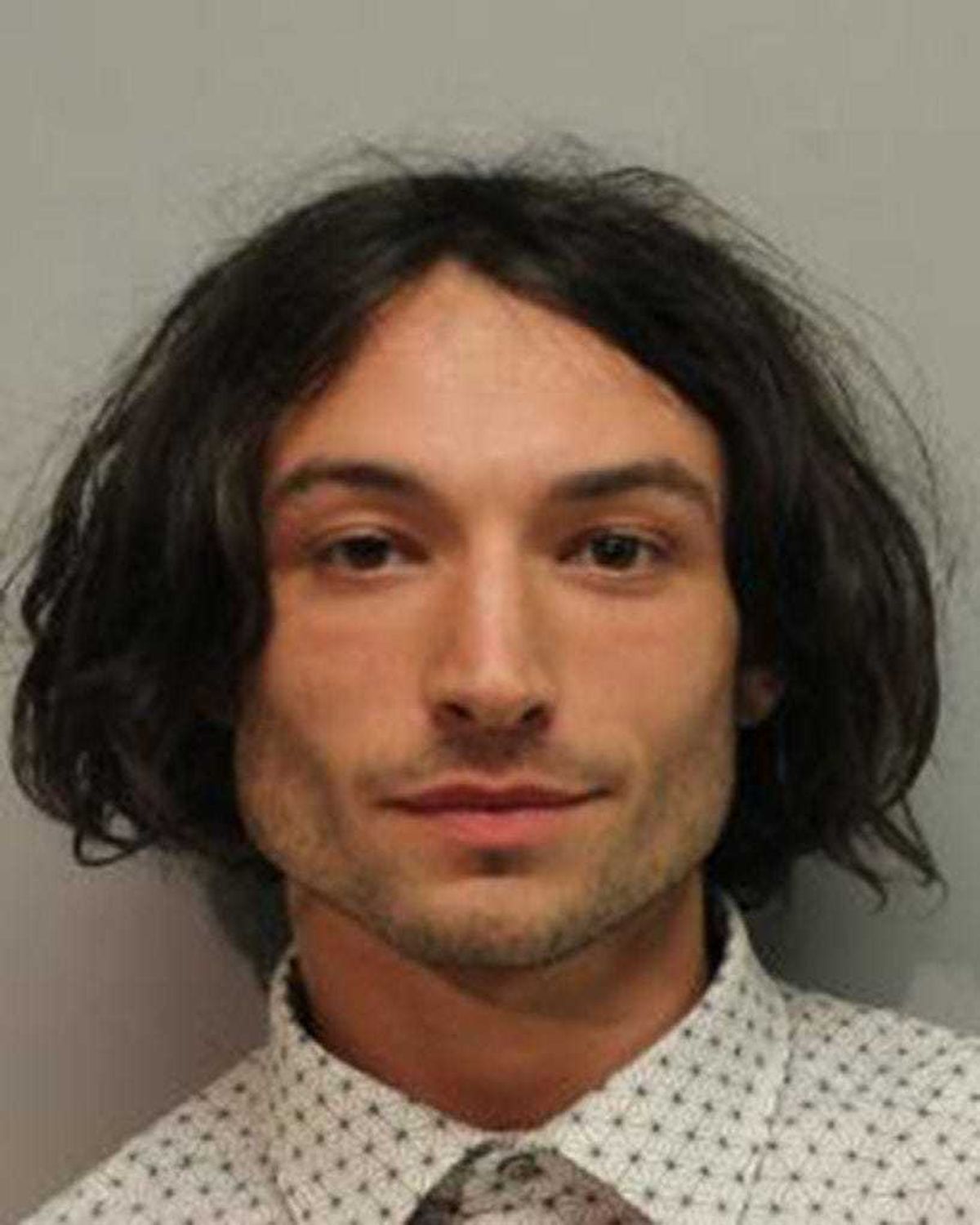 In this handout image provided by Hawaiʻi Police Department, Ezra Miller is seen in a police booking photo after his arrest for disorderly conduct and harassment on March 28, 2022 in Hilo, Hawaii. (Photo by Hawaiʻi Police Department via Getty Images)