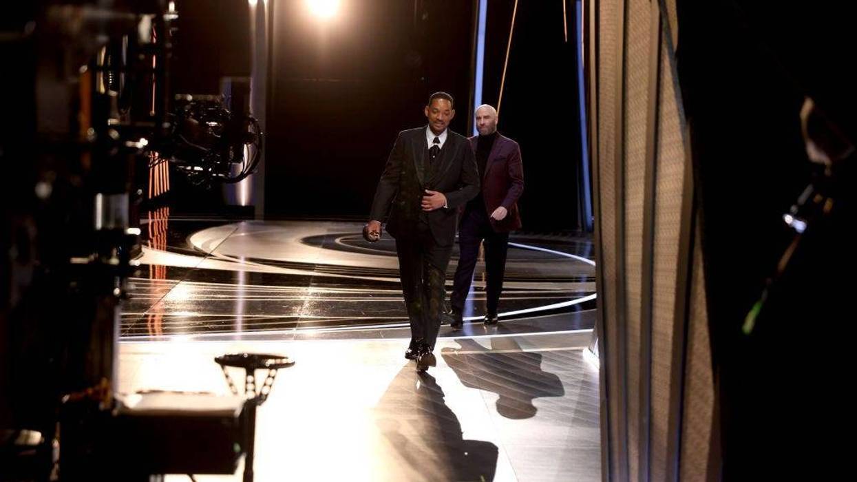 In this handout photo provided by A.M.P.A.S., Will Smith walks off stage during the 94th Annual Academy Awards at Dolby Theatre on March 27, 2022 in Hollywood, California.