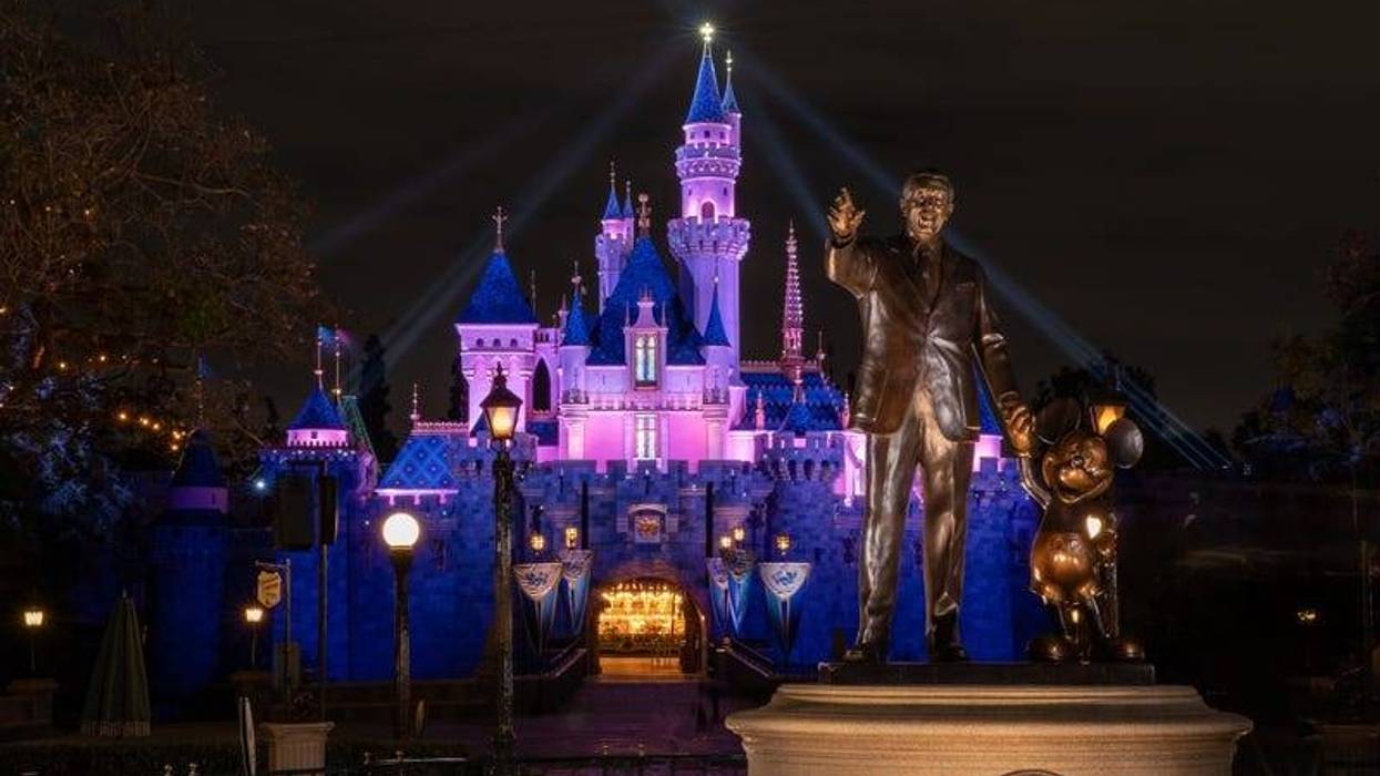 In this handout photo provided by Disneyland Resort, a view of Sleeping Beauty Castle in Disneyland Park illuminated during a special live streamed moment to welcome Cast Members back to the resort on April 26, 2021 at Disneyland Resort in Anaheim, California.