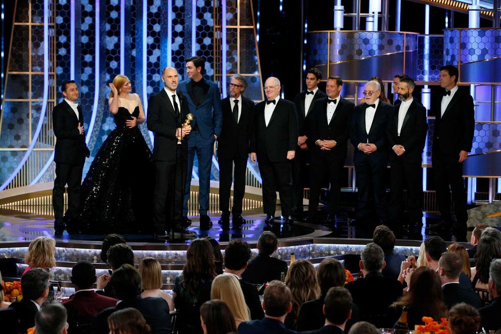 In this handout photo provided by NBCUniversal Media, LLC, Jesse Armstrong and the cast of "Succession", Kieran Culkin, Sarah Snook, Nicholas Braun, Alan Ruck, Brian Cox and Jeremy Strong, accept the award for BEST TELEVISION SERIES - DRAMA for "Succession" onstage, with Golden Globe Ambassador Paris Brosnan, during the 77th Annual Golden Globe Awards at The Beverly Hilton Hotel on January 5, 2020 in Beverly Hills, California.
