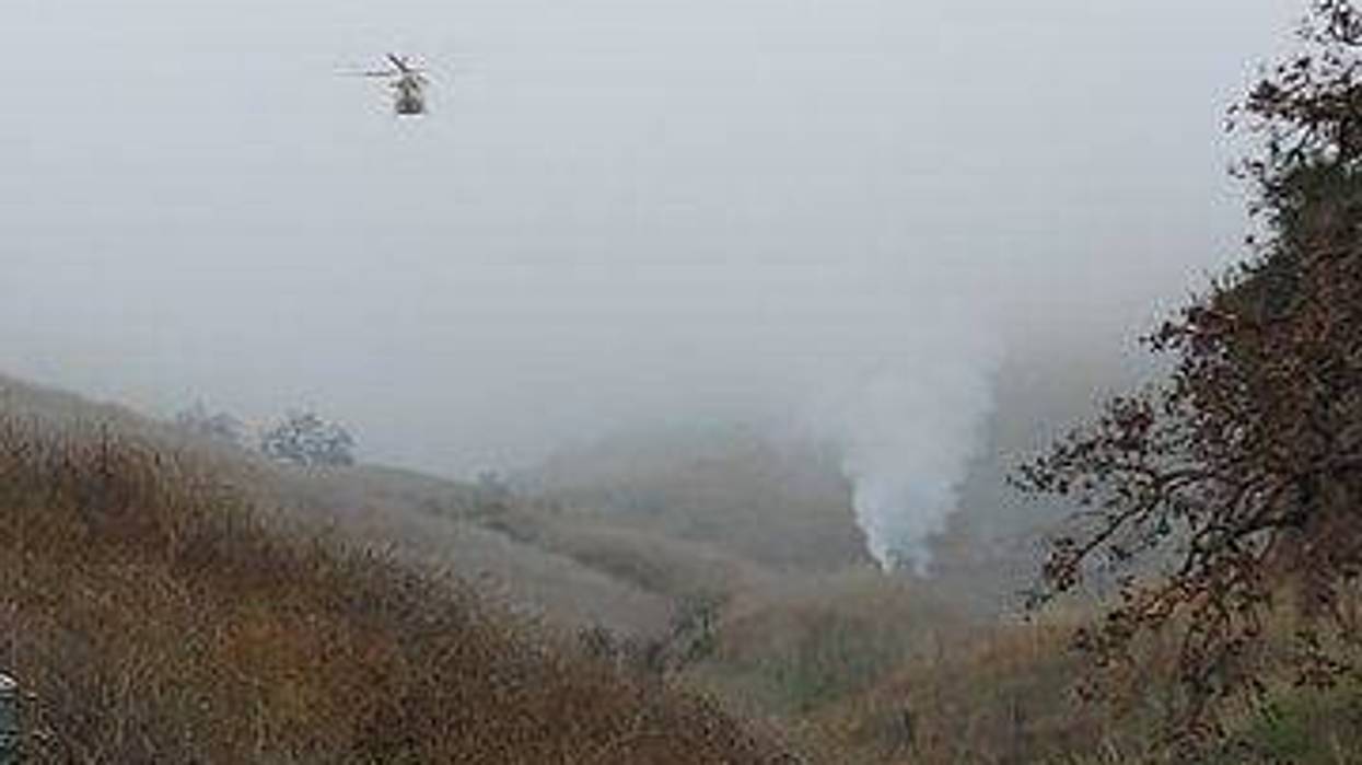 In this handout photo provided by the Los Angeles Sheriff’s Department, emergency crews respond to a helicopter crash that reportedly killed former NBA player Kobe Bryant on January 26, 2020 in Calabasas, California.