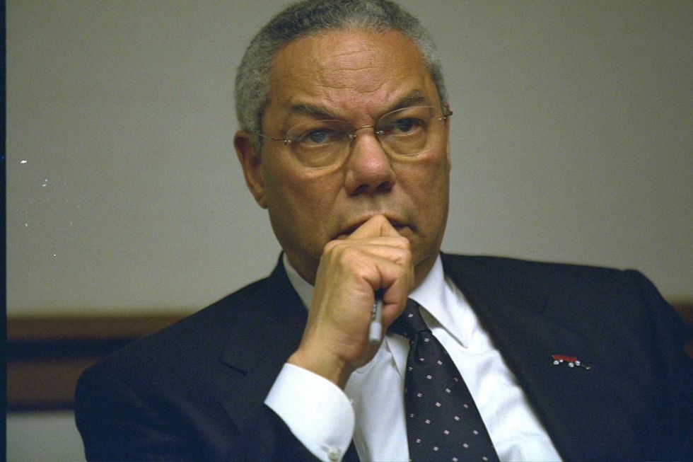 In this handout photo provided by the U.S. National Archives, Secretary of State Colin Powell meets in the President