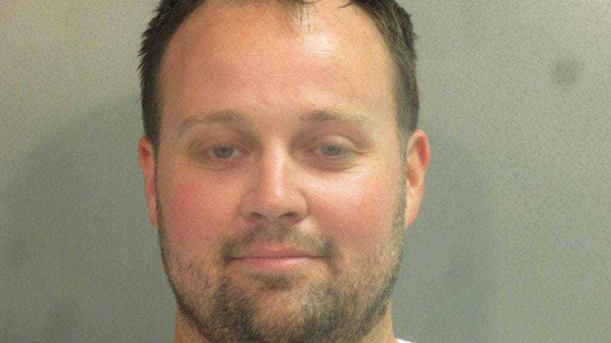 In this handout photo provided by the Washington County Sheriff’s Office, former television personality on "19 Kids And Counting" Josh Duggar poses for a booking photo after his arrest April 29, 2021 in Fayetteville, Arkansas. Duggar was reportedly arrested by federal agents and is being detained on a federal hold. (Photo by Washington County Sheriff’s Office via Getty Images)