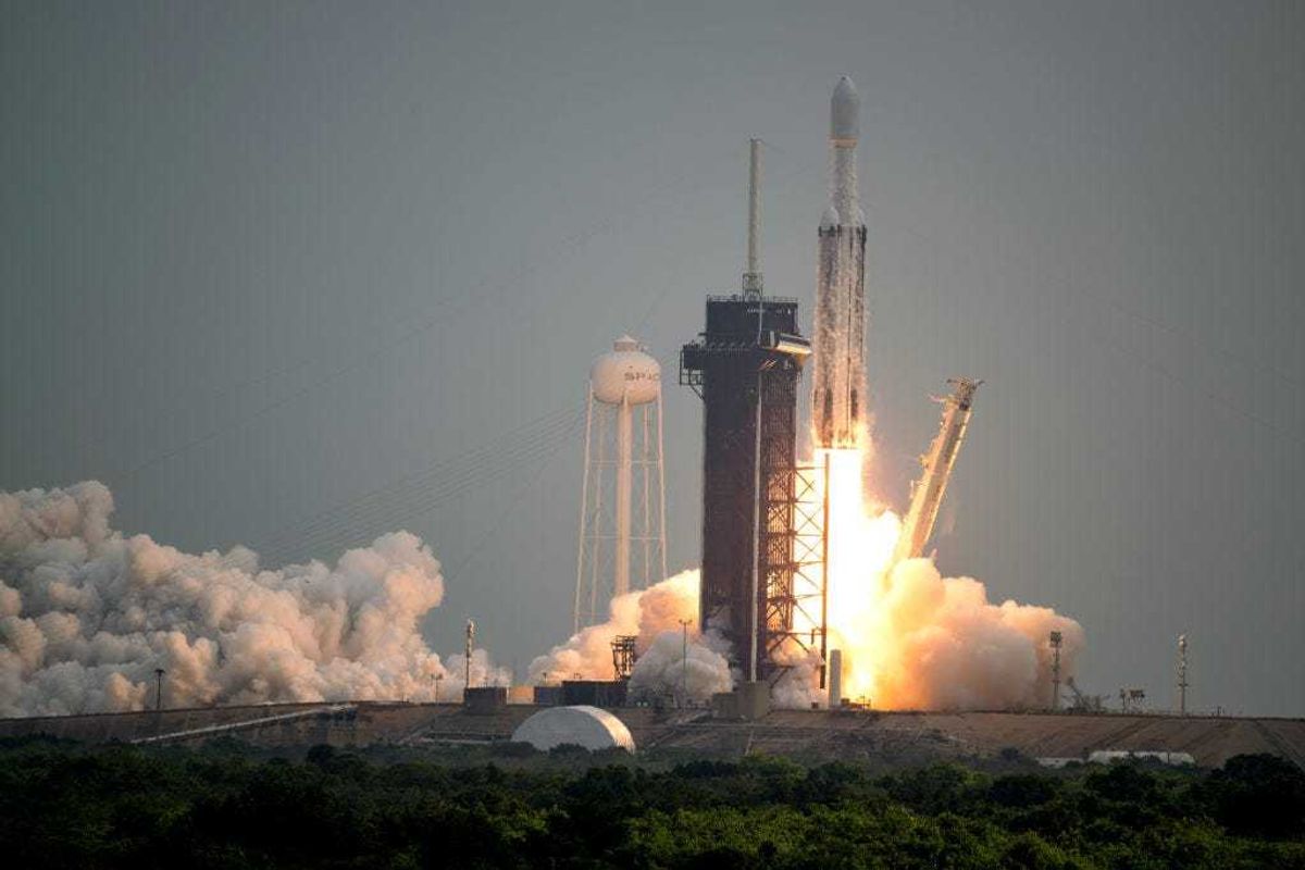 In this handout provided by NASA, a SpaceX Falcon Heavy rocket with the Psyche spacecraft onboard is launched from Launch Complex 39A, October 13, 2023 at NASA's Kennedy Space Center in Cape Canaveral, Florida.