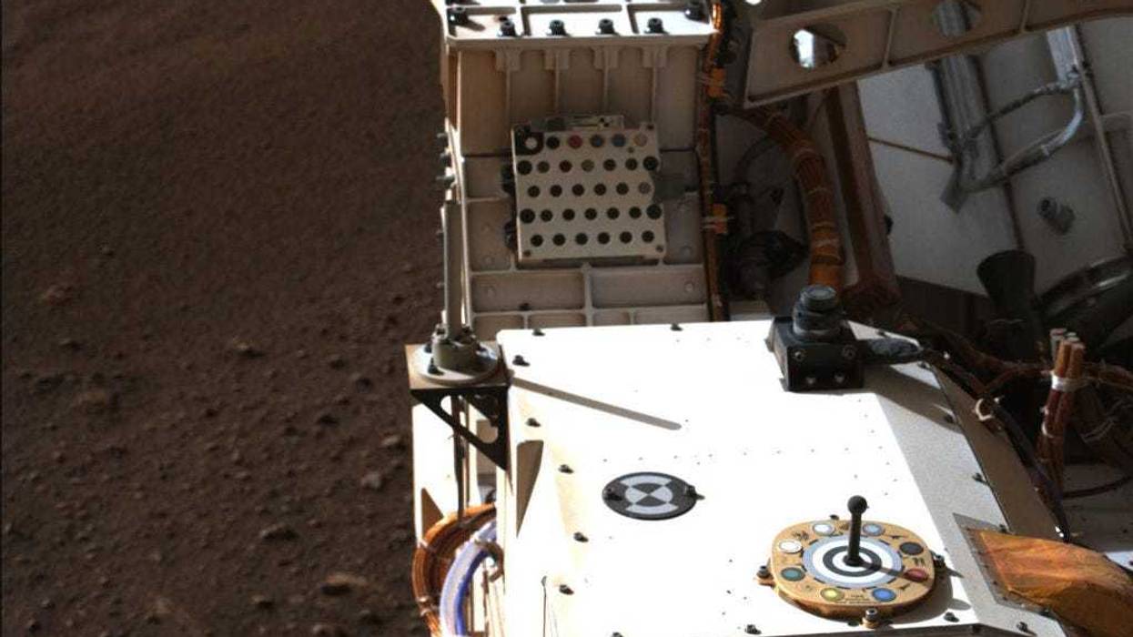 In this handout provided by NASA, Mastcam-Z, a pair of zoomable cameras aboard NASA’s Perseverance rover, images its calibration target for the first time since the rover landed on Mars.