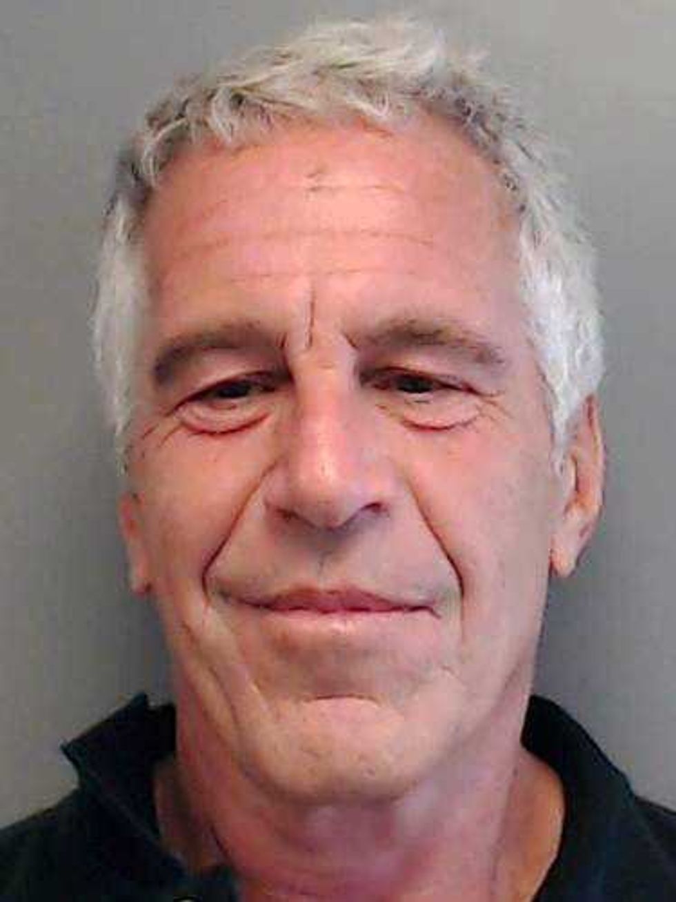 In this handout provided by the Florida Department of Law Enforcement, Jeffrey Epstein poses for a sex offender mugshot after being charged with procuring a minor for prostitution on July 25, 2013 in Florida. (Photo by Florida Department of Law Enforcement via Getty Images)