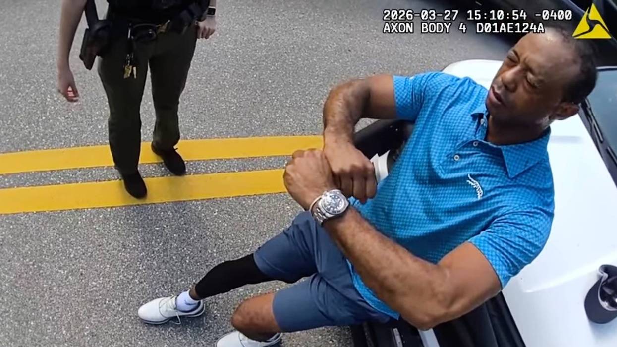 Bodycam shows a stunned Tiger Woods handcuffed after a Florida rollover crash