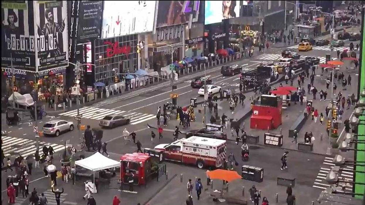 In this image taken from video by the FDNY, pedestrians hurry away from the scene of a shooting in Times Square, Saturday, May 8, 2021, in New York. New York City police say three innocent bystanders including a 4-year-old girl who was toy shopping have been shot in Times Square and officers are looking for suspects. All the victims are expected to recover.