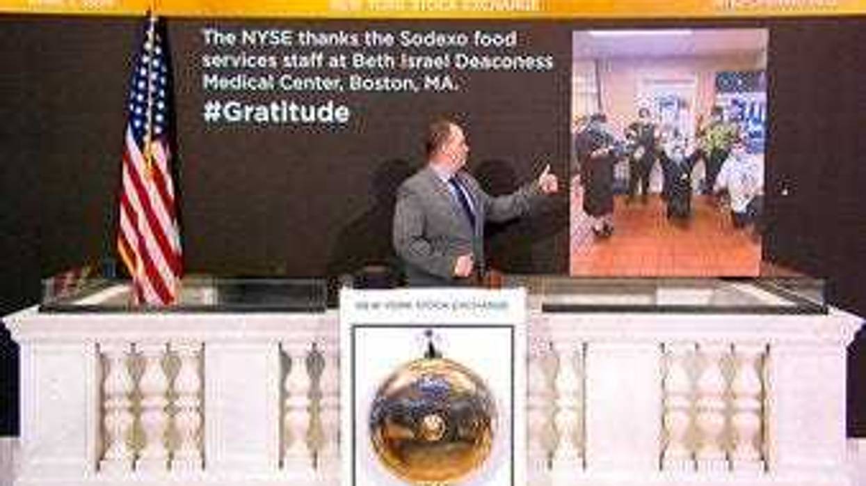 In this image taken from video provided by the New York Stock Exchange, Tommy Gannon, Assistant Supervisor, Facilities, rings the opening bell at the NYSE. (New York Stock Exchange via AP)