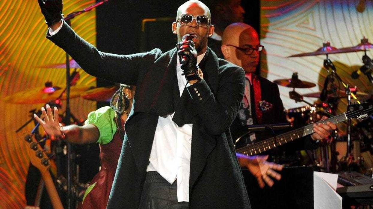 In this Jan. 25, 2014 file photo, recording artist R. Kelly performs at The 56th Annual Grammy Awards Salute to Industry Icons with Clive Davis in Beverly Hills, Calif.