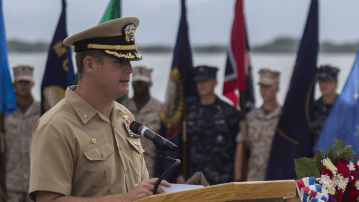 In this June 3, 2014, image provided by the U.S. Navy, Navy Capt. John R. Nettleton, then-commanding officer of Naval Station Guantanamo Bay, Cuba, speaks during a Battle of Midway commemoration ceremony.
