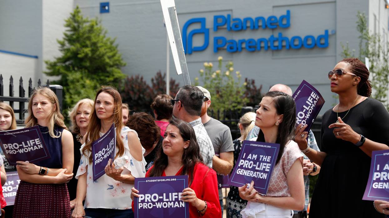 In this June 4, 2019, file photo, anti-abortion advocates gather outside the Planned Parenthood clinic in St. Louis.