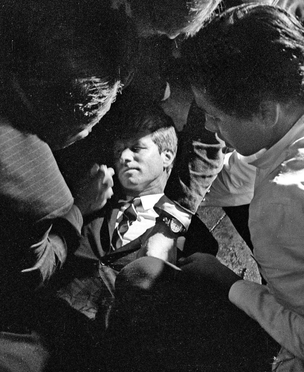 In this June 5, 1968 file photo, Hotel busboy Juan Romero (right) comes to the aid of Senator Robert F. Kennedy, as he lies on the floor of the Ambassador hotel in Los Angeles moments after he was shot. Romero was a teenage busboy in June 1968 when Kennedy walked through the Ambassador Hotel kitchen after his victory in the California presidential primary and an assassin shot him in the head. He held the mortally wounded Kennedy as he lay on the ground, struggling to keep the senator