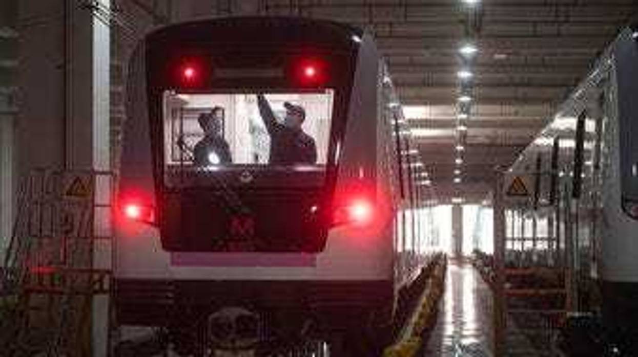 In this March 23, 2020 photo released by Xinhua News Agency, workers prepares a subway train for restoration of public transport in Wuhan, in central China's Hubei province. (Xiao Yijiu/Xinhua via AP)