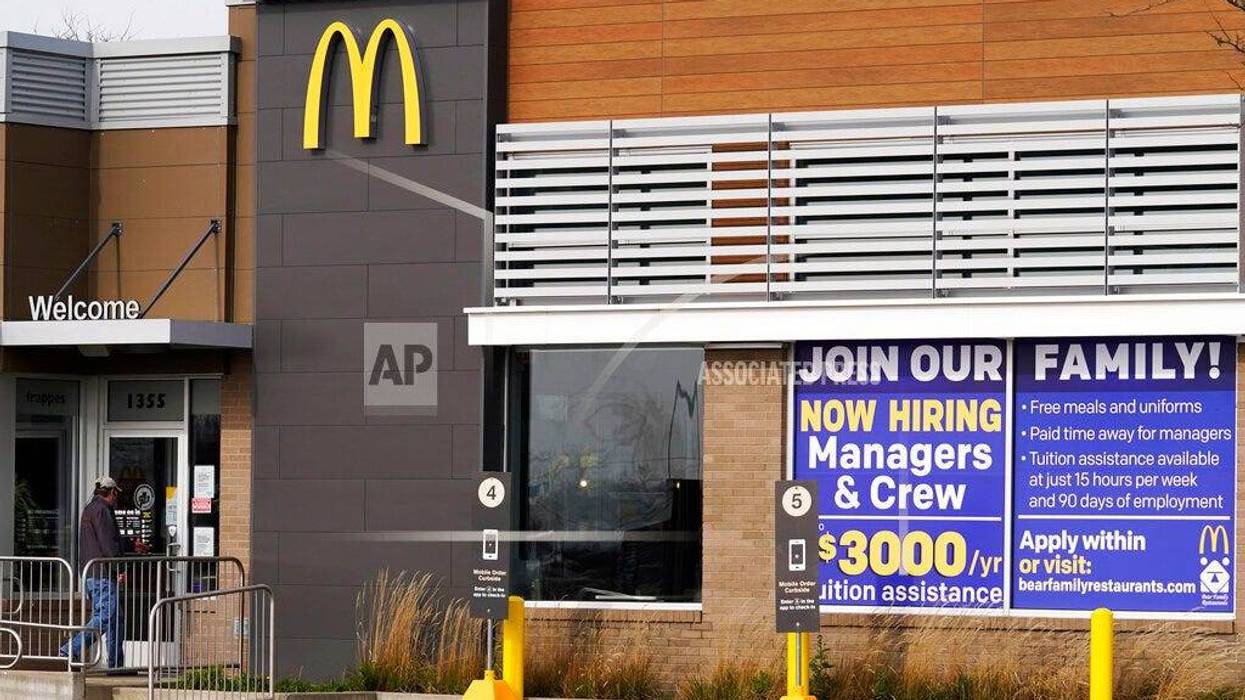 In this Nov. 19, 2020, file photo, a hiring sign is displayed outside of McDonald's in Buffalo Grove, Ill. On Wednesday, April 14, 2021, McDonald’s said the company will mandate worker training to combat harassment, discrimination and violence in its restaurants worldwide starting in 2022.