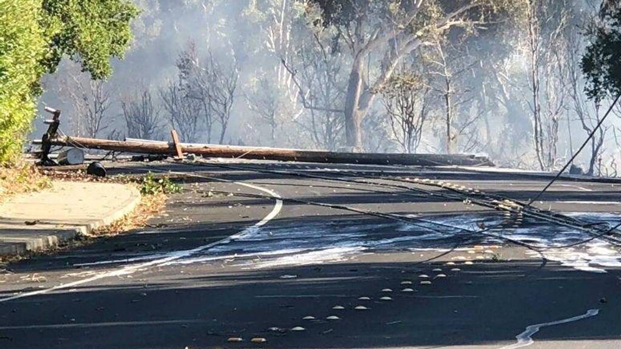 In this photo are power lines in Lafayette, Calif., that show damage near where a fire started.