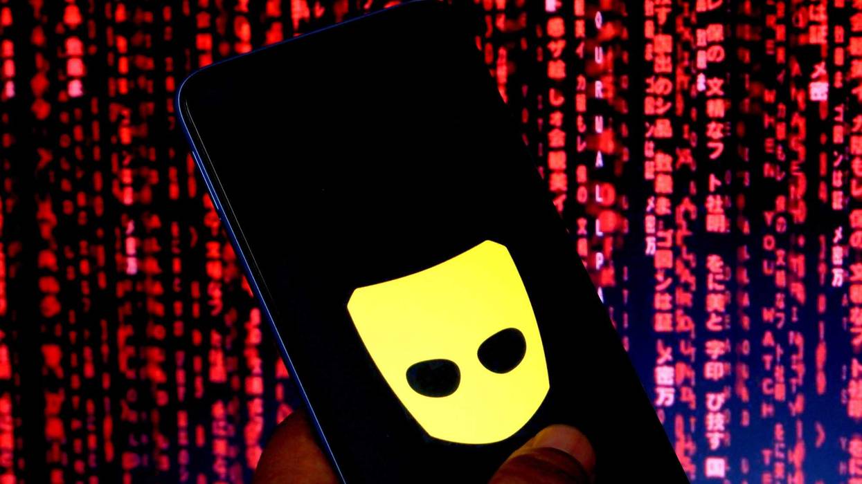 In this photo illustration a Grindr logo seen displayed on a smartphone.