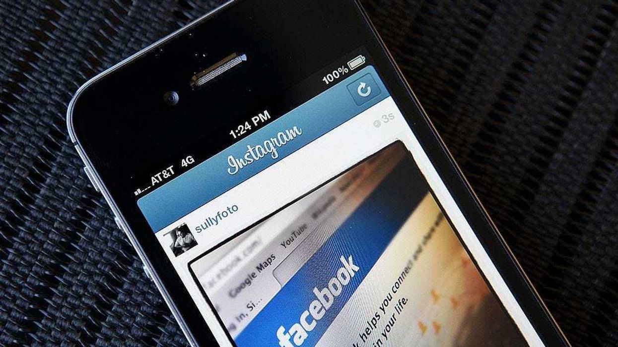 In this photo illustration, an Instagram photo of the Facebook website app is seen on an Apple iPhone on April 9, 2012 in New York City. Facebook Inc. is acquiring photo-sharing app Instagram for approx. $1 billion.