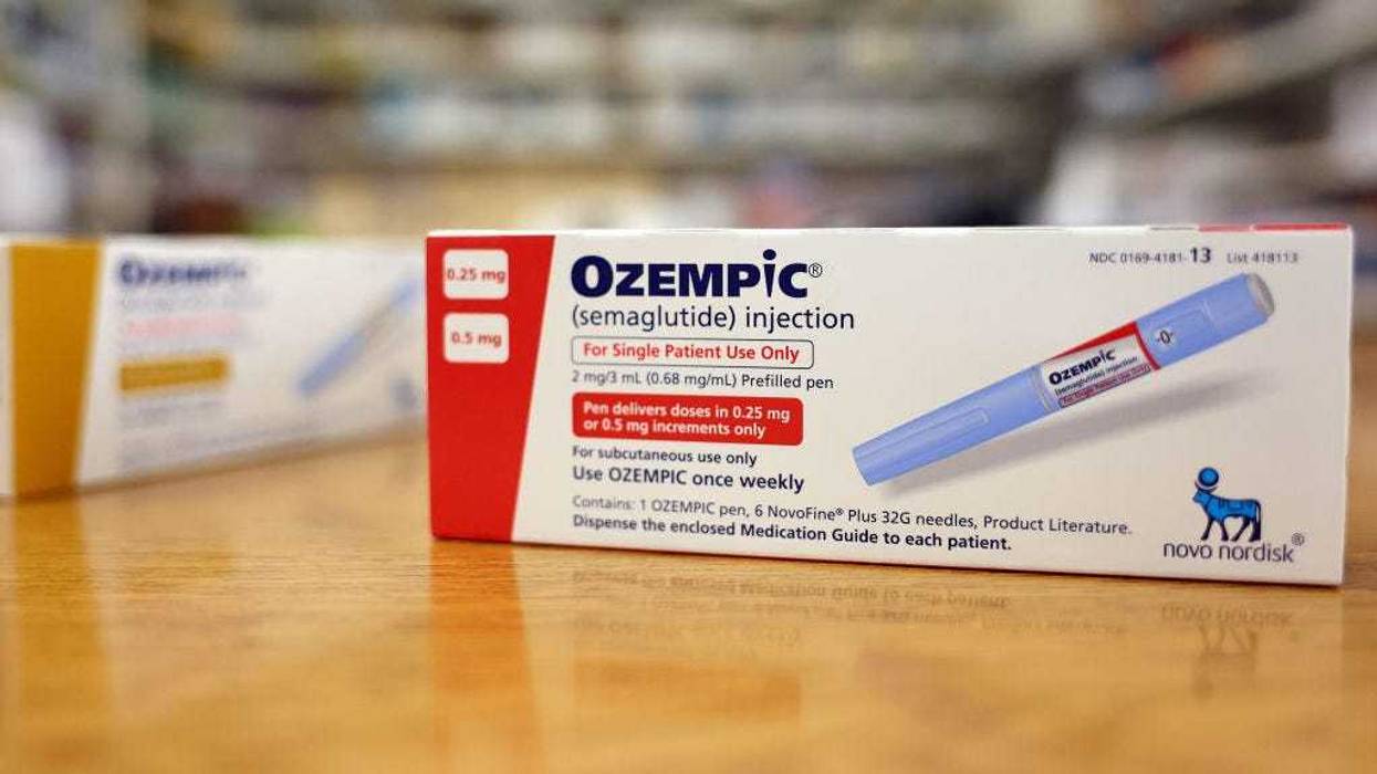 In this photo illustration, boxes of the diabetes drug Ozempic rest on a pharmacy counter on April 17, 2023 in Los Angeles, California.