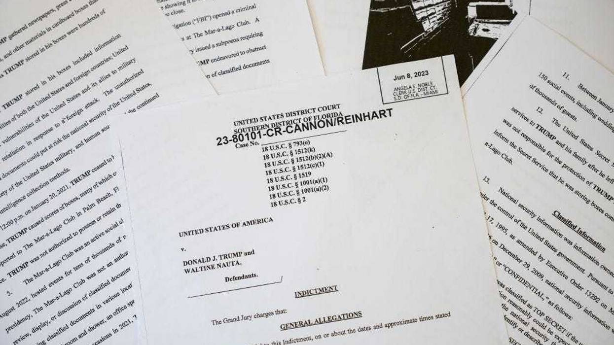 In this photo illustration, pages are viewed from the unsealed federal indictment of former U.S. President Donald Trump on June 9, 2023 in Washington, DC. Former U.S. President Donald Trump has been indicted on 37 felony counts in Special Counsel Jack Smith's classified documents probe.