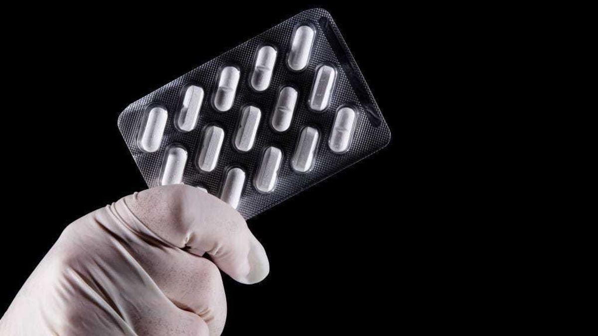 In this photo illustration, tablets on a blister pack of Plaquinol (Hydroxychloroquine) are displayed on April 10, 2020 in Rio de Janeiro, Brazil.