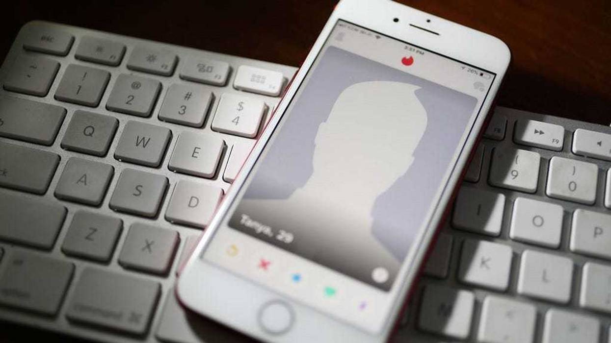 In this photo illustration, the dating app Tinder is seen on the screen of an iPhone on August 14, 2018 in Miami, Florida.