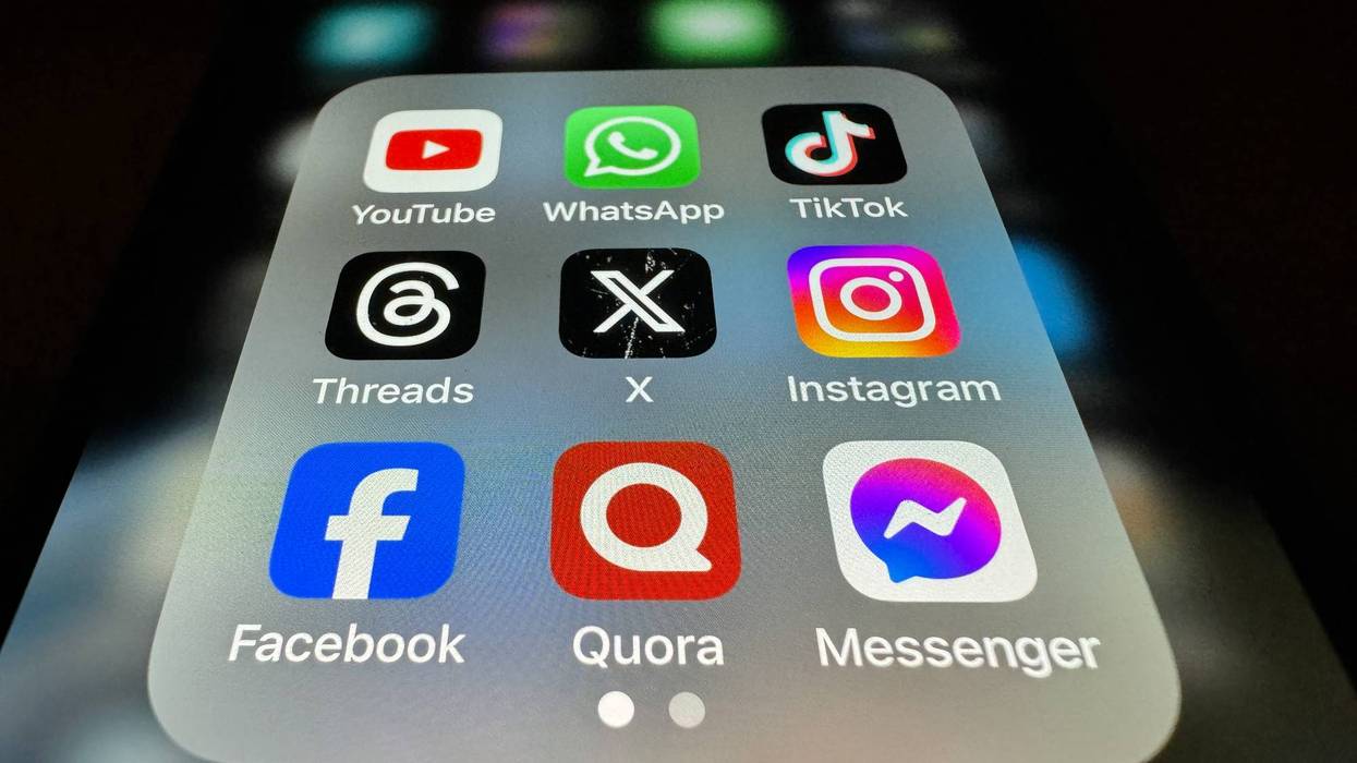 In this photo illustration the logo of US online social media and social networking site 'X' (formerly known as Twitter) is displayed centrally on a smartphone screen alongside that of Threads (L) and Instagram (R) on October 29, 2023 in Bath, England. On the top row the logo of online video sharing and social media platform YouTube is seen alongside that of Whatsapp and TikTok. Along the bottom row Facebook, Quora amd Messenger are displayed. It has been over a year since Elon Musk controversially bought the company in which he made lots of redundancies and also rebranded Twitter to the the letter 'X'