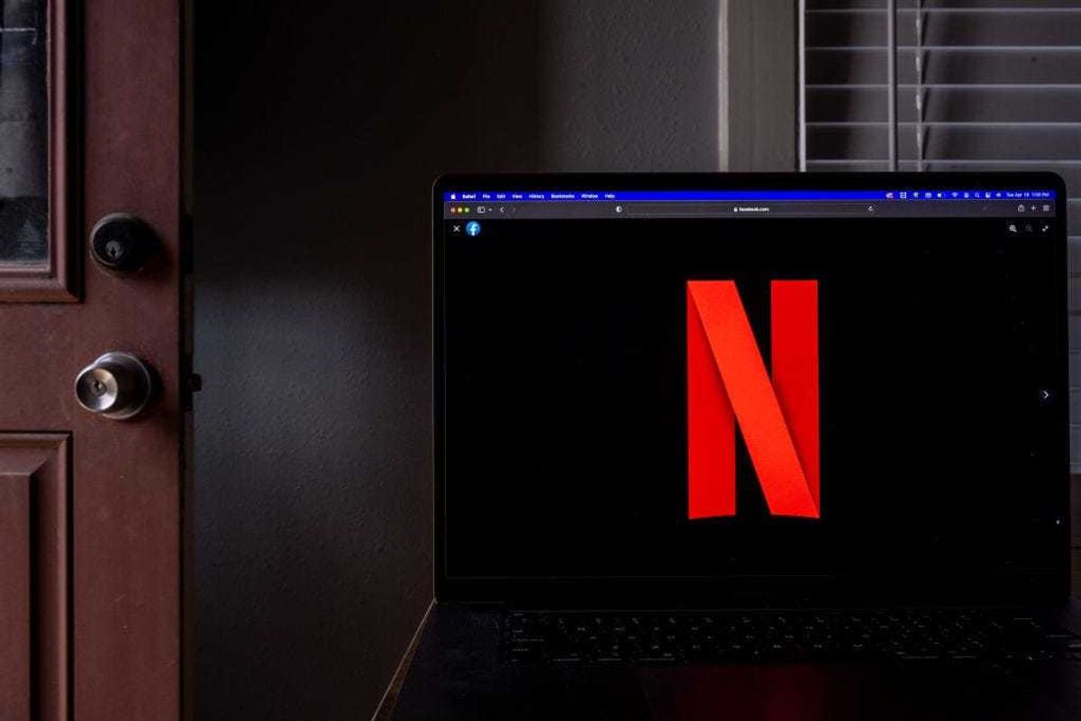 In this photo illustration, the Netflix emblem is shown on a laptop on April 19, 2022 in Houston, Texas. The company Netflix is expected to report its first-quarter earnings after the close of trading later today. The report will be for the fiscal Quarter ending March 2022. (Photo Illustration by Brandon Bell/Getty Images)