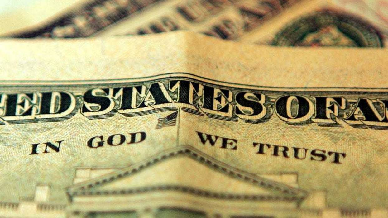 In this photo illustration the phrase "In God We Trust" can be seen on an American ten dollar bill on October 23, 2008 in London, England.