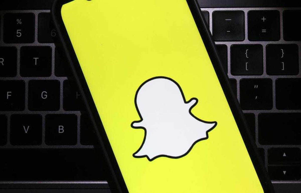 In this photo illustration, the Snapchat logo is displayed on a cell phone screen on February 03, 2022 in San Anselmo, California.