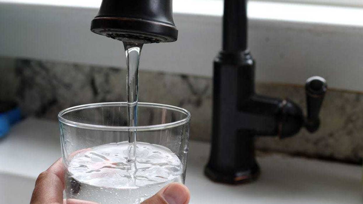 In this photo illustration, water from a tap fills a glass on July 06, 2023 in San Anselmo, California. According to a study by the US Geological Survey, nearly half of the tap water in the United States is contaminated with "forever chemicals" that are considered dangerous to human health. Per and polyfluorinated alkyl substances, or PFAS, are chemicals that linger in the body and are linked to health issues like cancer, obesity, liver damage, decreased fertility, thyroid disease, high cholesterol and hormone suppression. (Photo Illustration by Justin Sullivan/Getty Images)