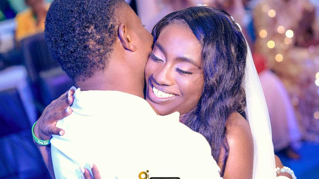 In this photo provided by Gesh Creatives, Eunice Dwumfour celebrates her Nov. 24, 2022 marriage at Champions Royal Assembly in Abuja, Nigeria, with husband and fellow pastor Peter Ezechukwu