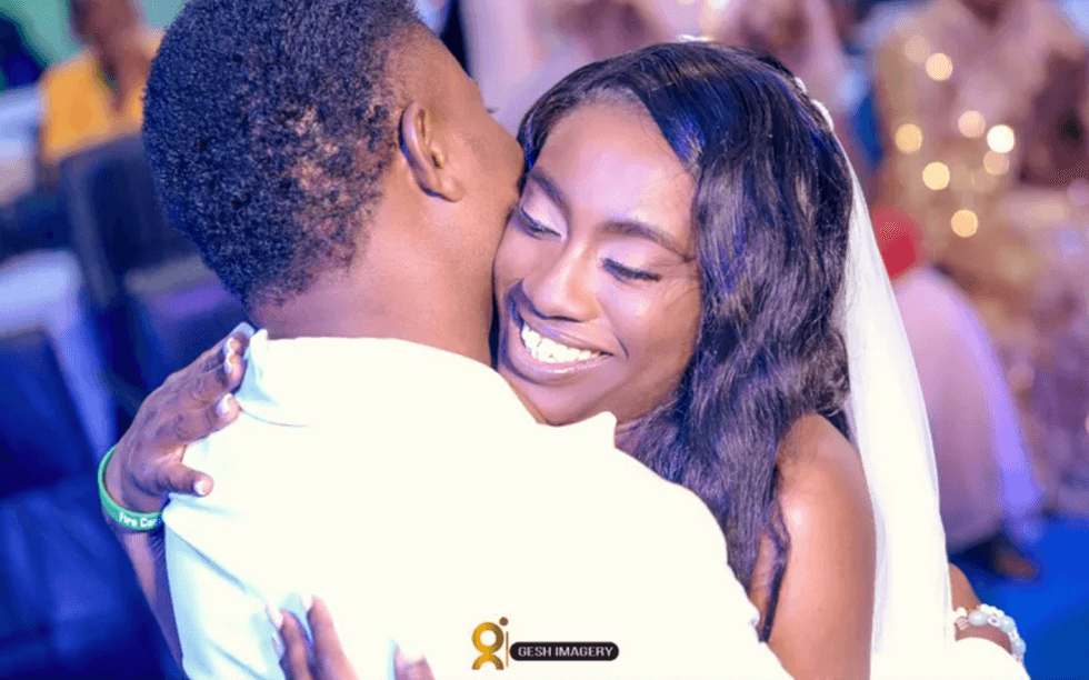 In this photo provided by Gesh Creatives, Eunice Dwumfour celebrates her Nov. 24, 2022, marriage at Champions Royal Assembly in Abuja, Nigeria, with husband and fellow pastor Peter Ezechukwu.