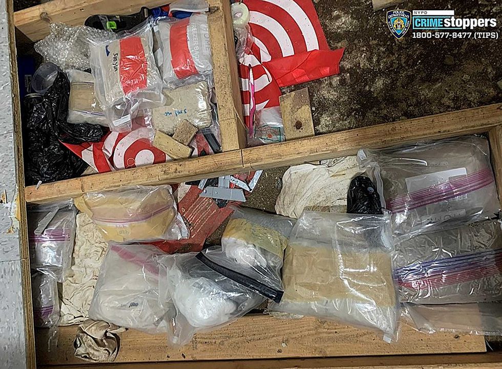 In this photo provided by the NYPD, narcotics, including fentanyl, and drug paraphernalia lie stored in the floor of a day care center, Sept. 21, 2023, in New York.