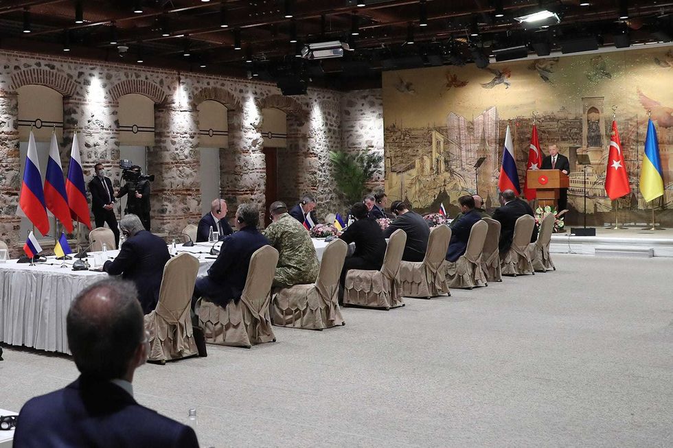 In this photo provided by Turkish Presidency, Turkish President Recep Tayyip Erdogan, right, gives a speech to welcome the Russian and Ukrainian delegations ahead of their talks, in Istanbul, Turkey, Tuesday, March 29, 2022