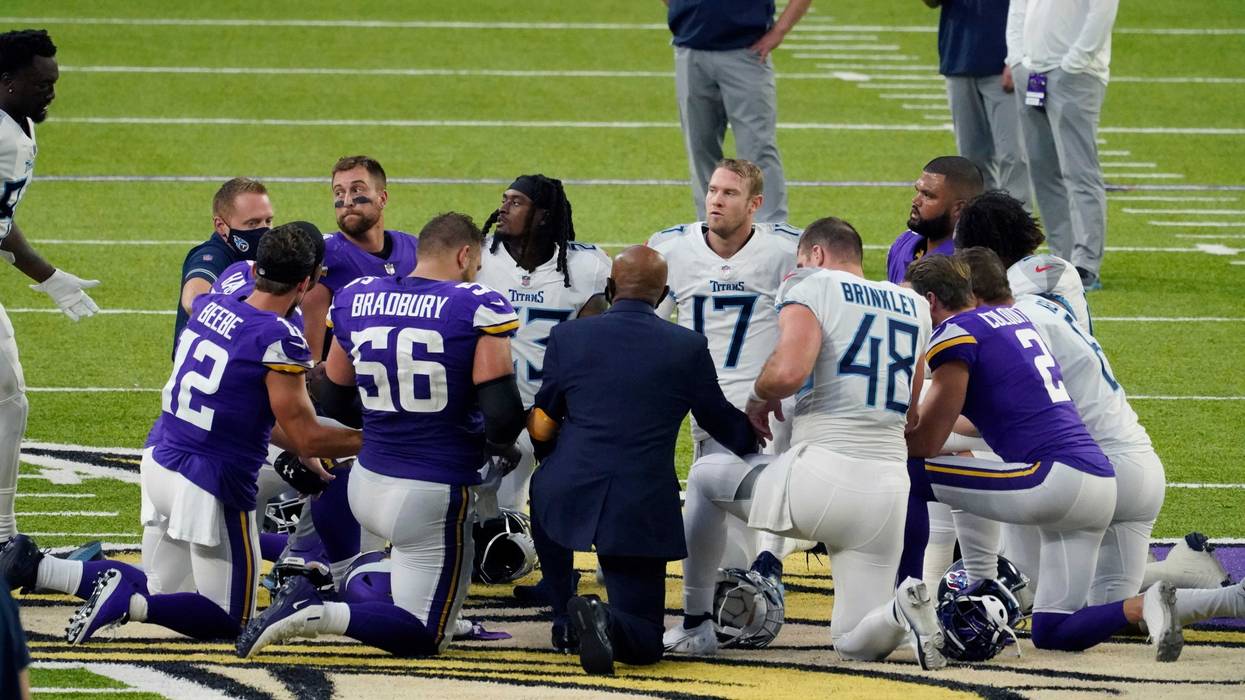 In this Sept. 27, 2020, file photo, Tennessee Titans and the Minnesota Vikings players meet at midfield following an NFL football game in Minneapolis.