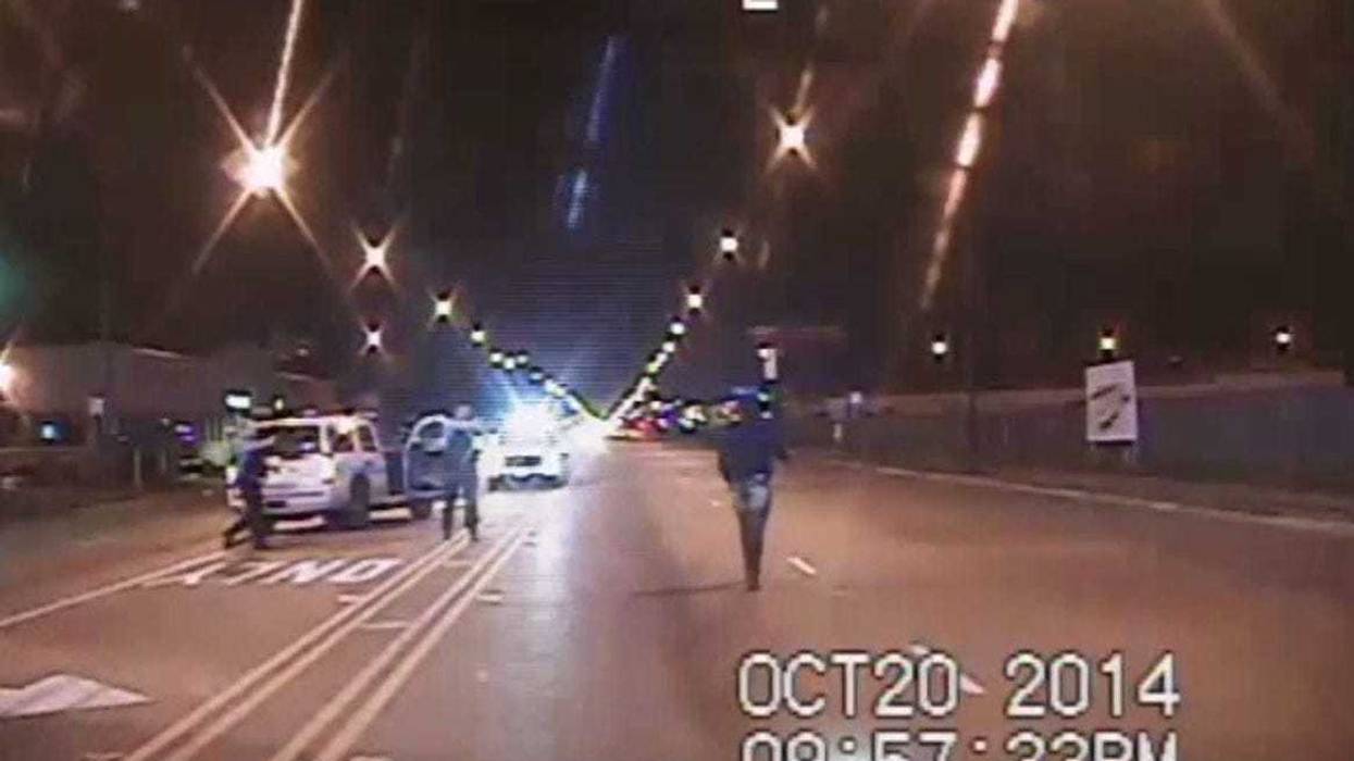 In this still image taken from a police vehicle dash camera, Laquan McDonald walks up a street just prior to being shot by Chicago Police Officer Jason Van Dyke on Oct. 20, 2014, in Chicago. Officer Van Dyke was charged with first degree murder for the shooting, in which McDonald was hit with 16 bullets.