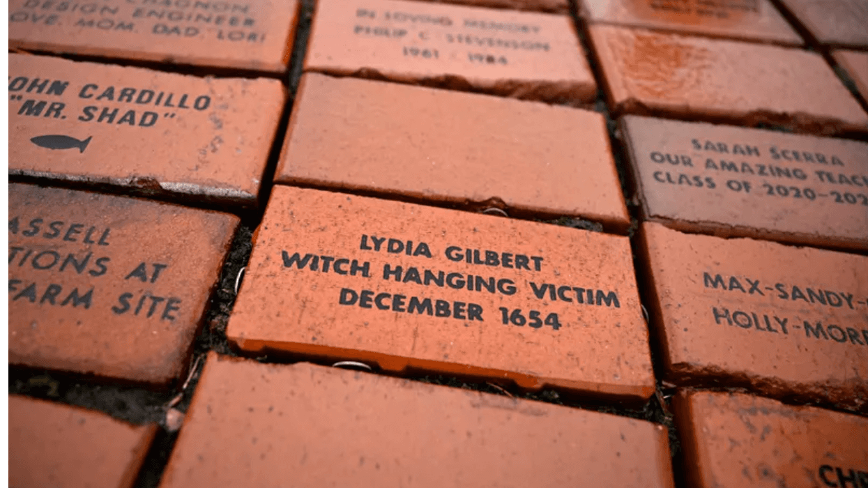 In this Tuesday, Jan. 24, 2023 photo, a brick memorializing Lydia Gilbert is placed in a town Heritage Bricks installation in Windsor, Conn.