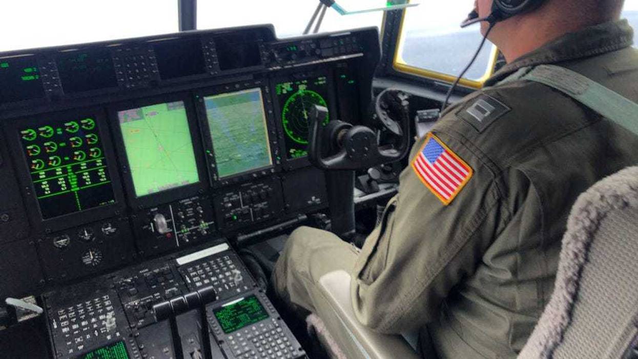 In this U.S. Coast Guard handout, Coast Guard Air Station Elizabeth City, North Carolina crewmembers aboard an HC-130 Hercules airplane aid in the search for the 21-foot submersible, Titan, approximately 900 miles East of Cape Cod, June 21, 2023 over the Atlantic Ocean. The unified command is searching for five people after the Canadian research vessel Polar Prince lost contact with their submersible during a dive to the wreck of the Titanic on June 18, 2023. (Photo by Petty Officer 1st Class Amber Howie/ U.S. Coast Guard via Getty Images)