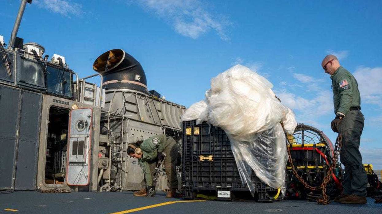 In this U.S. Navy handout, Sailors assigned to Assault Craft Unit 4 prepare material recovered in the Atlantic Ocean from a high-altitude balloon for transport to federal agents at Joint Expeditionary Base Little Creek Feb. 10, 2023.