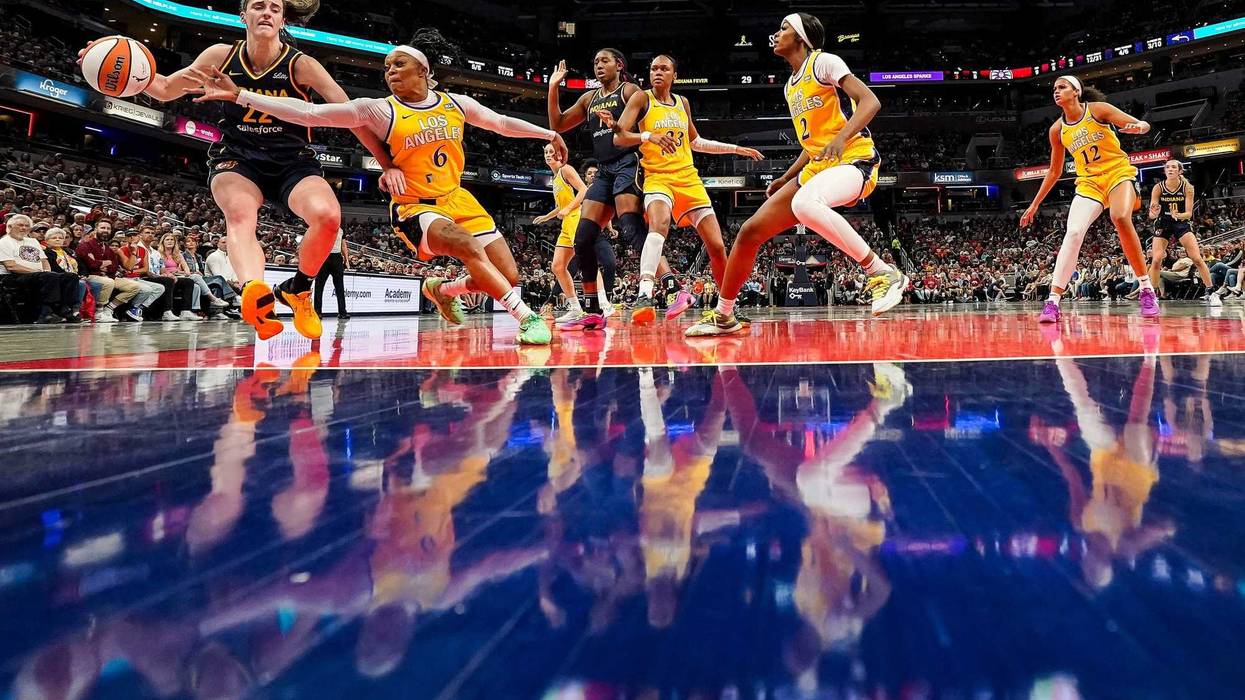 Indiana Fever guard Caitlin Clark (22) rushes up the court against Los Angeles Sparks Odyssey Sims (6) on Wednesday, Sept. 4, 2024, during the game at Gainbridge Fieldhouse in Indianapolis. The Indiana Fever defeated the Los Angeles Sparks, 93-86.